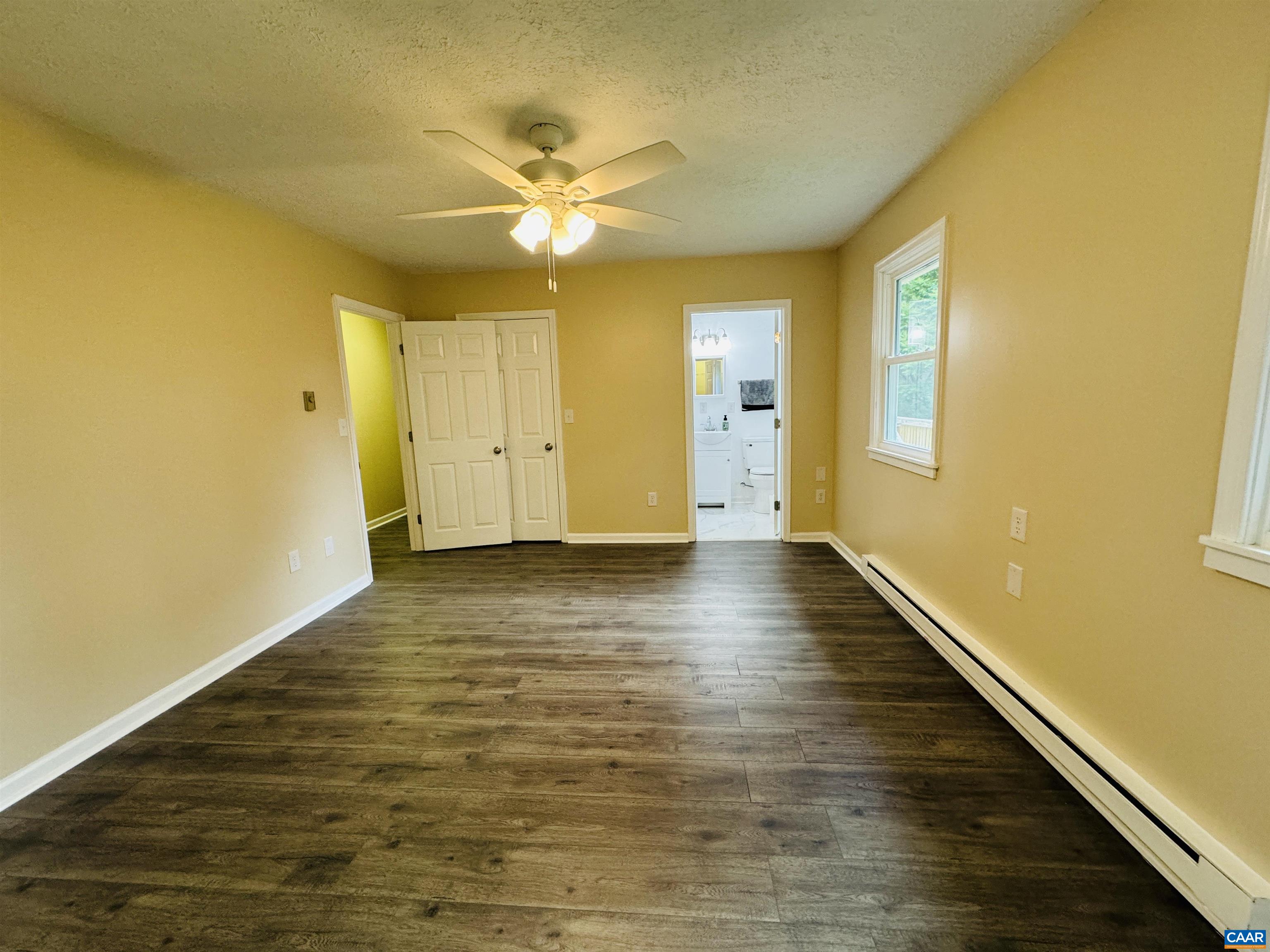 5000 White Bridge Road Waynesboro, VA 22980 - Photo 49 of 74 a view of an empty room with wooden floor and a window