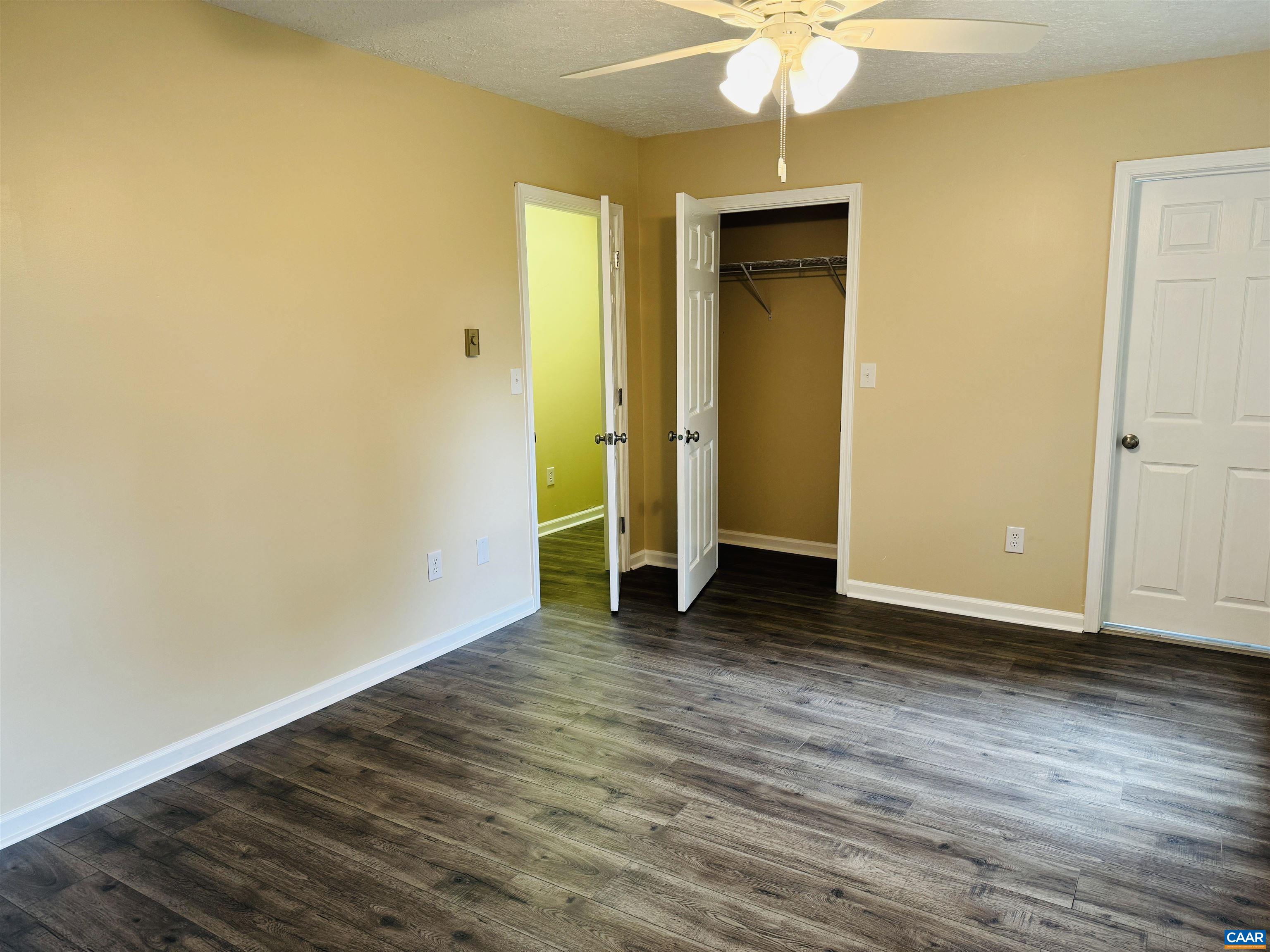 5000 White Bridge Road Waynesboro, VA 22980 - Photo 54 of 74 a view of a room with wooden floor and a ceiling fan