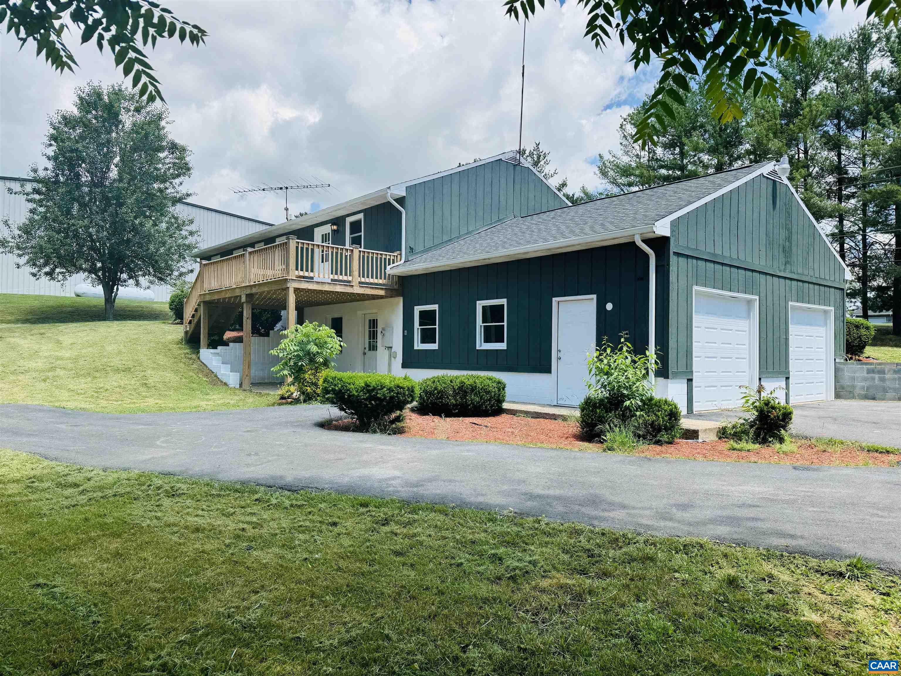 5000 White Bridge Road Waynesboro, VA 22980 - Photo 8 of 74 a front view of a house with a yard and potted plants