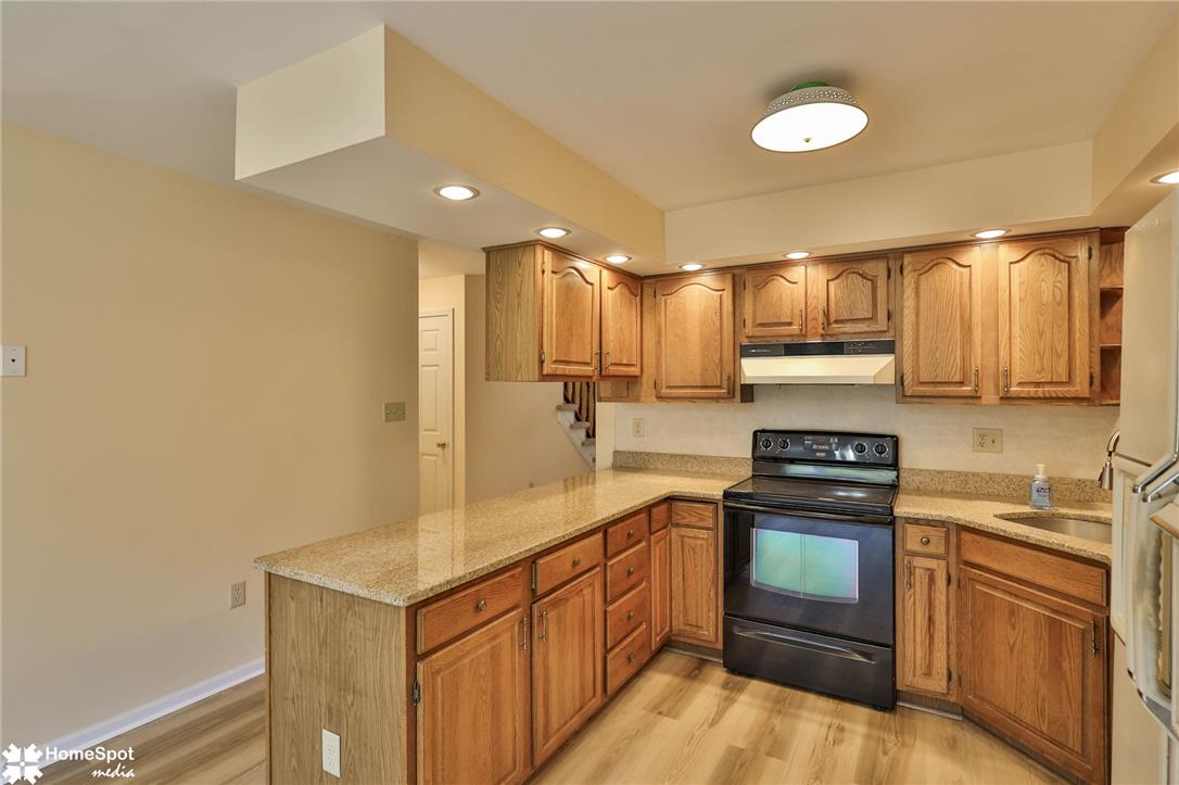 4059 Wedgewood Road Allentown, PA 18104 - Photo 17 of 72 Functional kitchen with ample cabinetry and stone countertops.