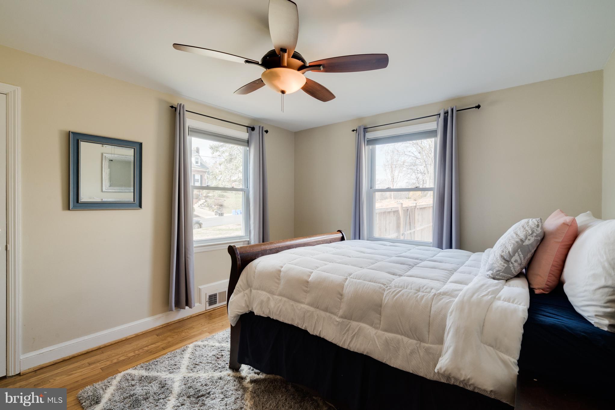 10303 Ridgemoor Drive Silver Spring, MD 20901 - Photo 14 of 29 a bedroom with a bed and a window