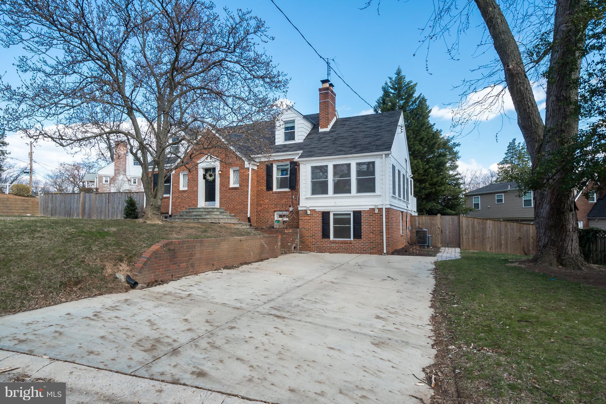 10303 Ridgemoor Drive Silver Spring, MD 20901 - Photo 3 of 29 front view of a house with a yard