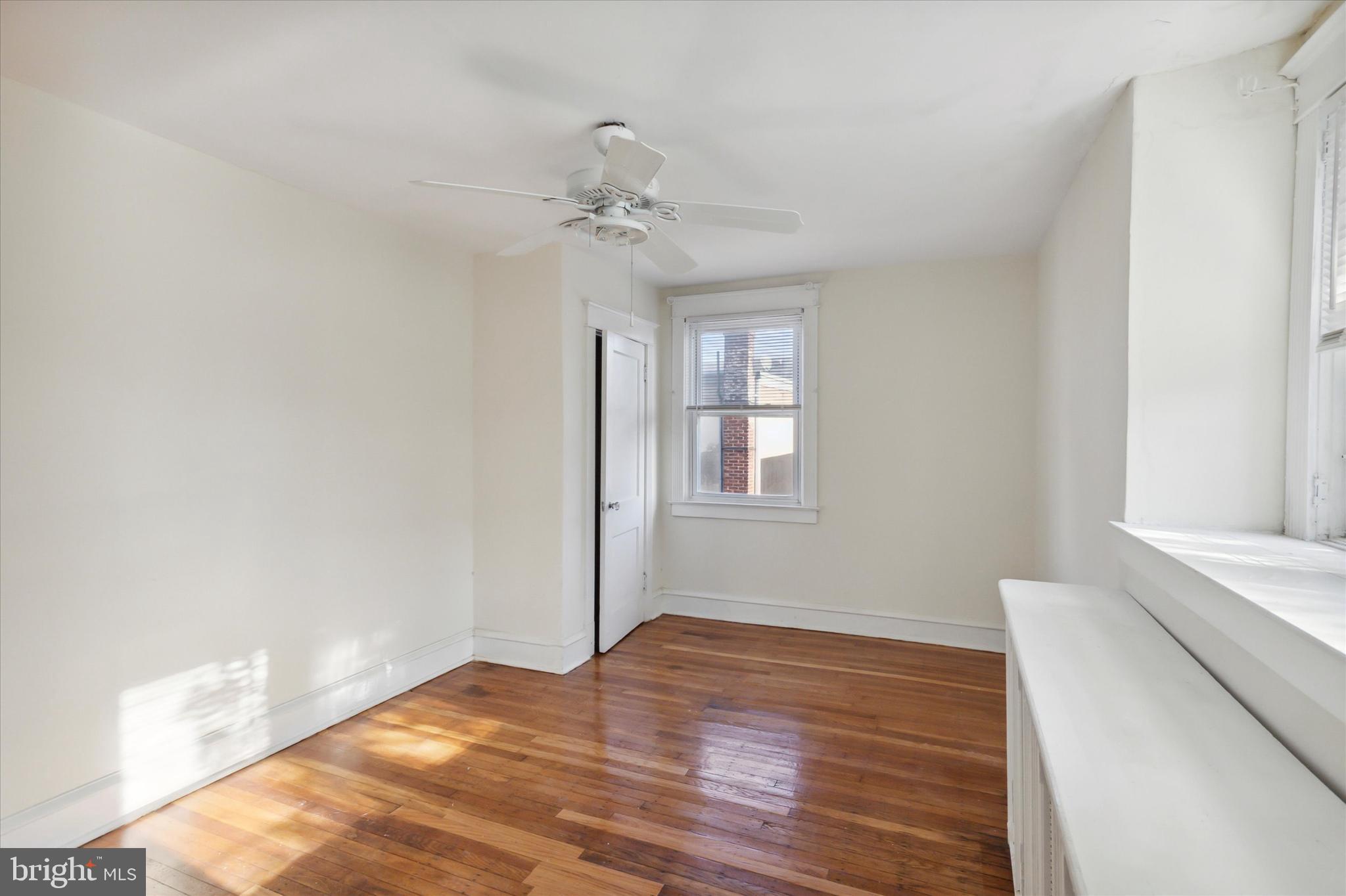 255 Shirley Road Upper Darby, PA 19082 - Photo 21 of 36 a view of empty room with wooden floor and fan