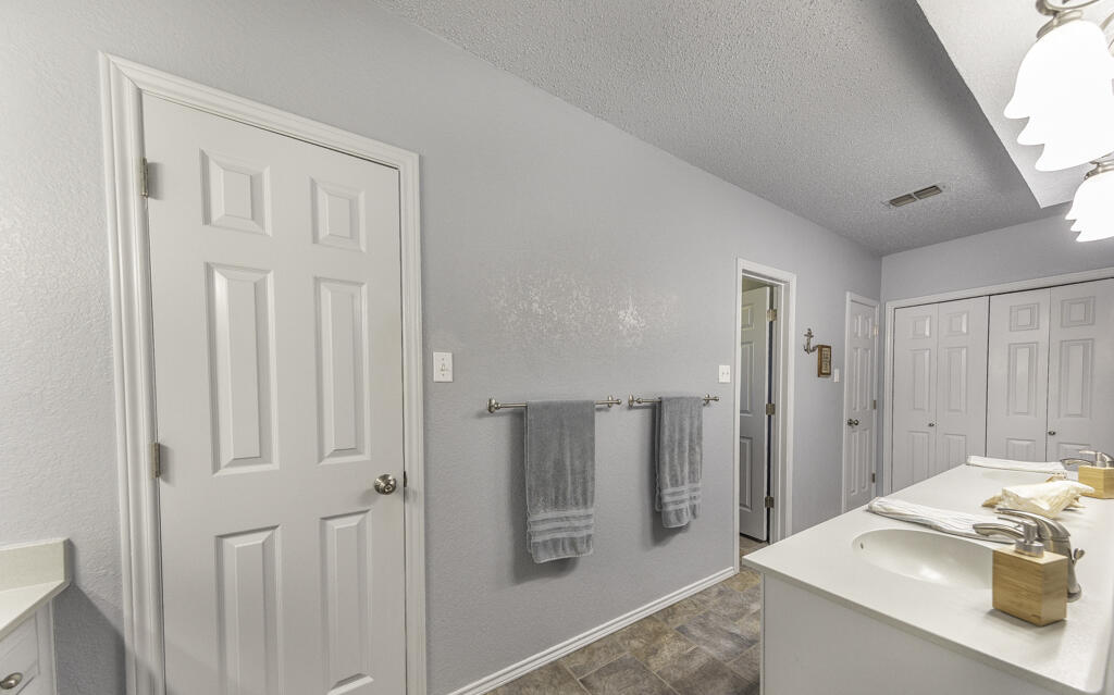 3620 93rd Street Lubbock, TX 79423 - Photo 19 of 33 a kitchen with stainless steel appliances granite countertop a refrigerator and a sink