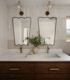 a bathroom with sink and mirror