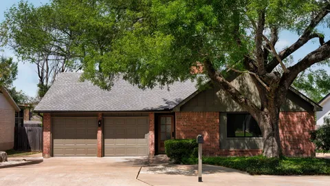 a house with a tree in front of it