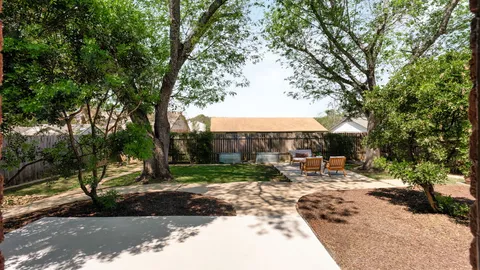a view of backyard with patio