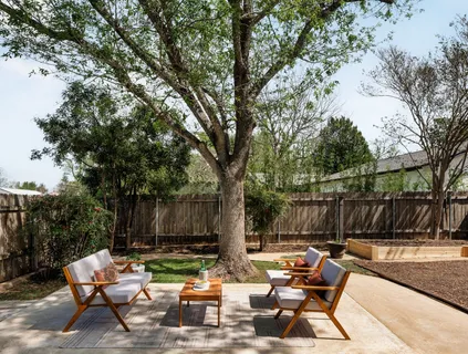 a view of backyard with seating space