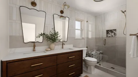 a bathroom with a double vanity sink toilet and shower
