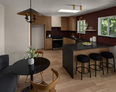 a kitchen with a table and chairs in it