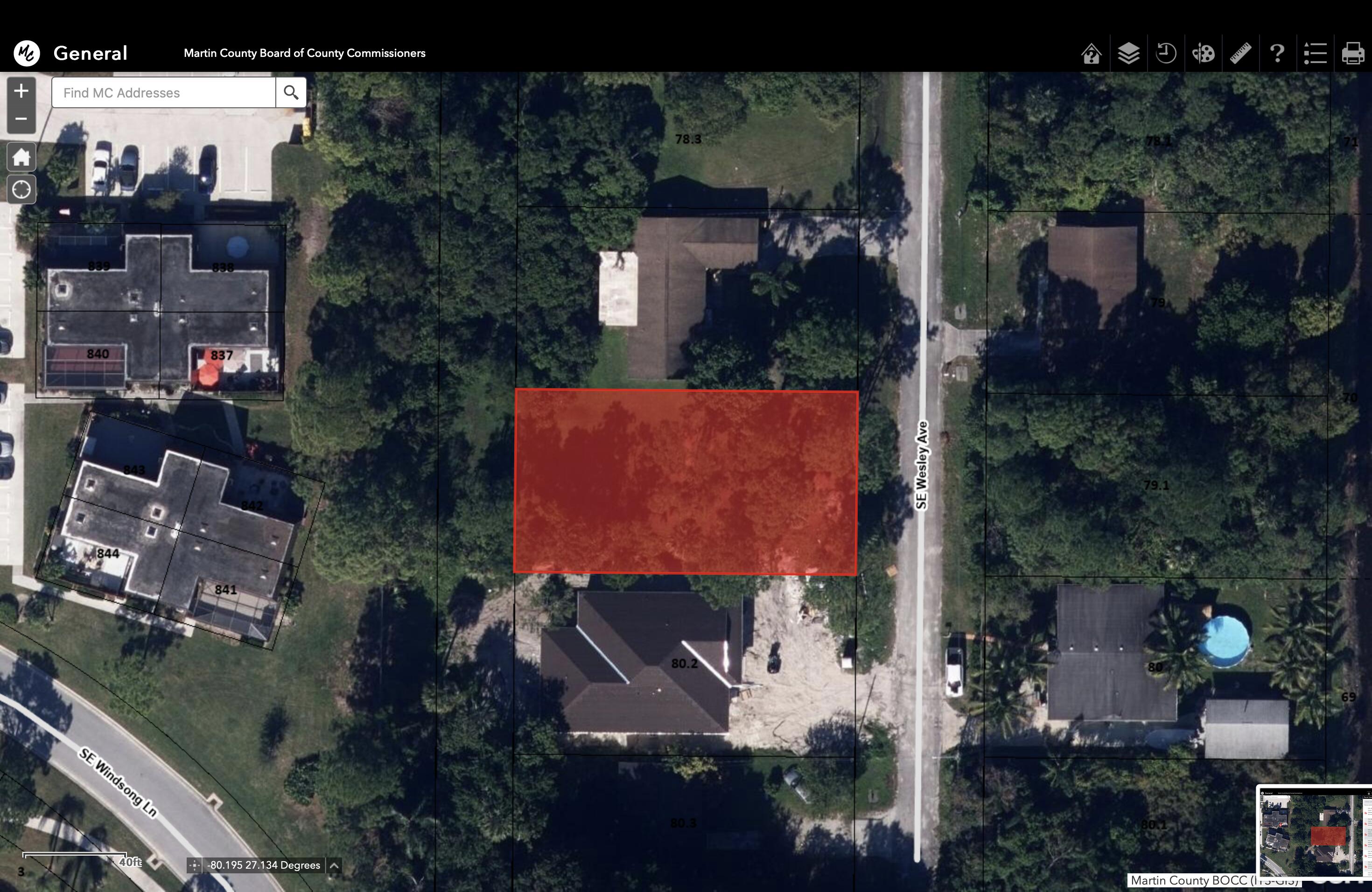 5866 Southeast Wesley Avenue Stuart, FL 34997 - Photo 5 of 6 an aerial view of multiple houses with a yard
