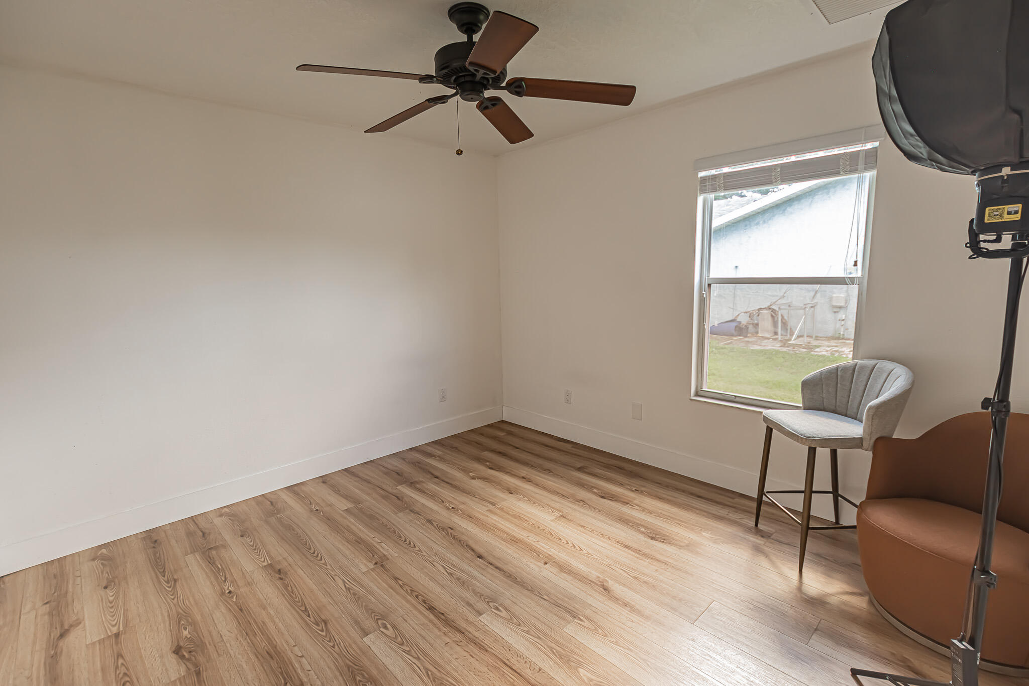 526 Southwest Dairy Road Port St. Lucie, FL 34953 - Photo 12 of 23 a view of room with window and wooden floor