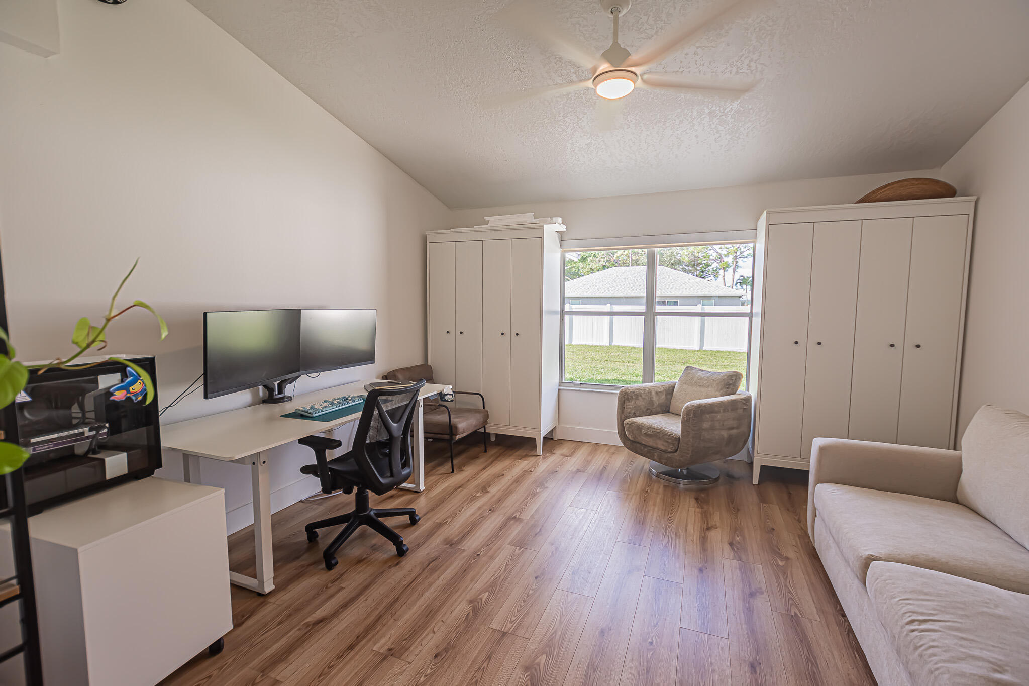 526 Southwest Dairy Road Port St. Lucie, FL 34953 - Photo 13 of 23 a workspace with furniture hardwood and a window
