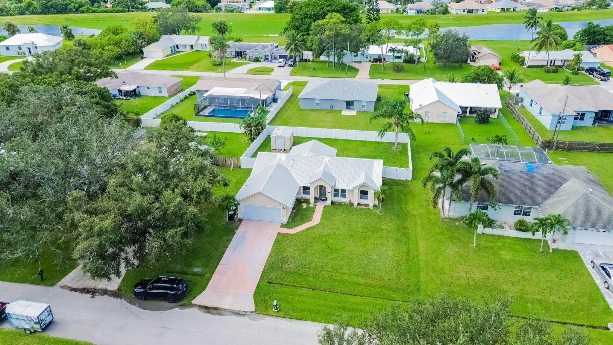 526 Southwest Dairy Road Port St. Lucie, FL 34953 - Photo 19 of 23 an aerial view of multiple houses with yard