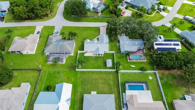 an aerial view of a house with a garden