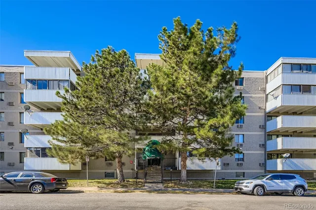a view of a cars parked in front of a building