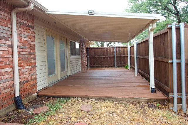 a view of a pathway of a house with backyard