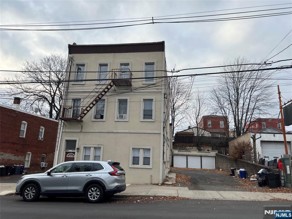 a view of a car parked in front of a building