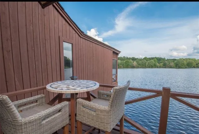 a balcony view with a seating space