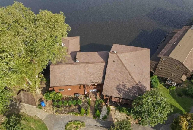 an aerial view of a house with a yard and plants