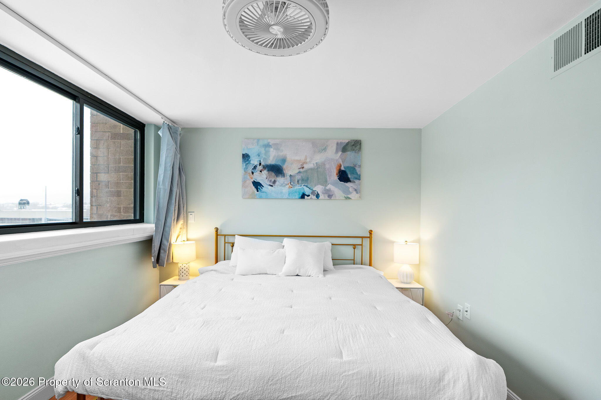 220 Linden Street, Unit 503 Scranton, PA 18503 - Photo 23 of 40 a bedroom with a bed and a large window