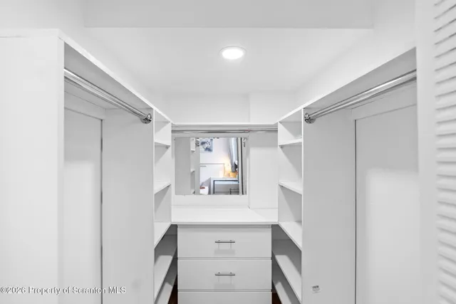 a view of a hallway with seating area