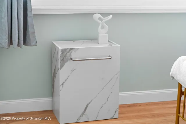 a bedroom with a bed and a view of kitchen