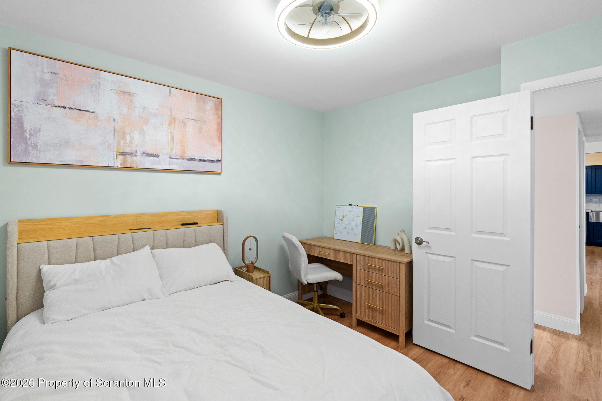 220 Linden Street, Unit 503 Scranton, PA 18503 - Photo 34 of 40 a bedroom with a bed and a view of kitchen