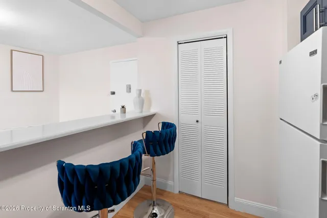 a view of entryway with wooden floor