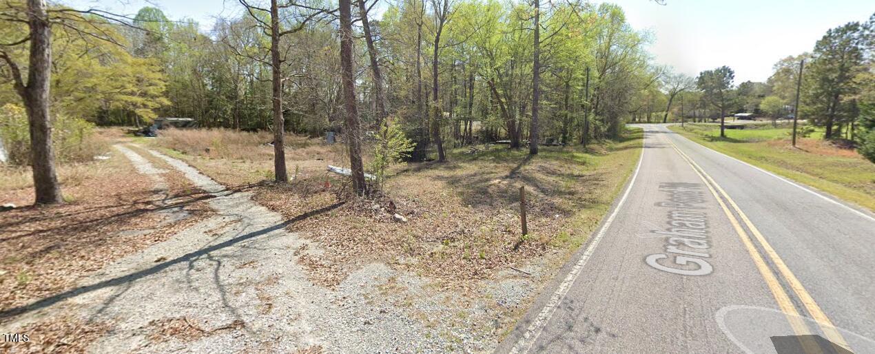 1049 Graham Pond Road Angier, NC 27501 - Photo 18 of 18 a view of a yard with a slide