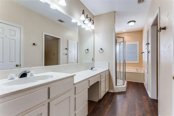 a bathroom with a sink double vanity and a mirror