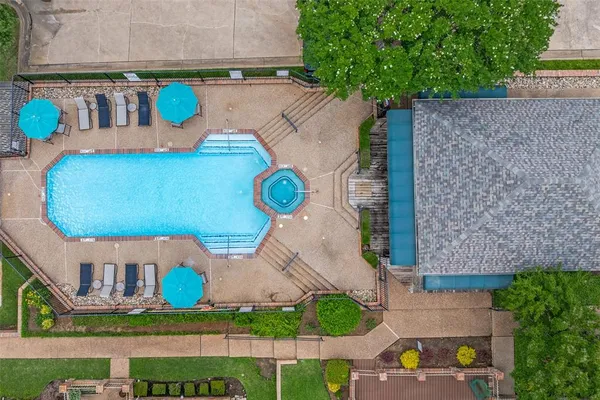 an aerial view of a house with a swimming pool