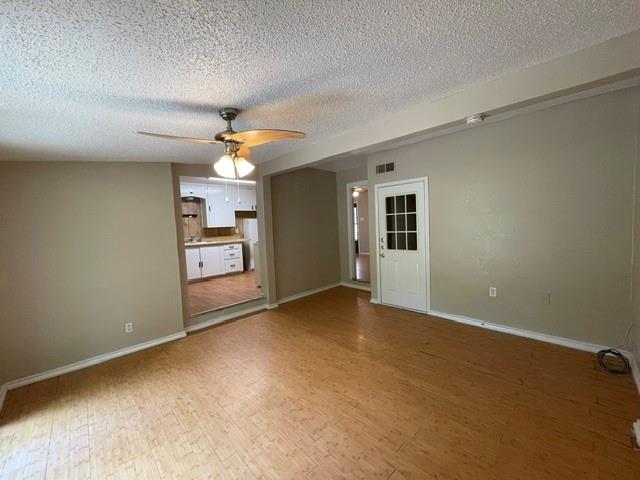845 Rumfield Road White Settlement, TX 76108 - Photo 14 of 19 an empty room with windows and ceiling fan