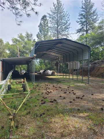 a view of a wooden deck with a yard