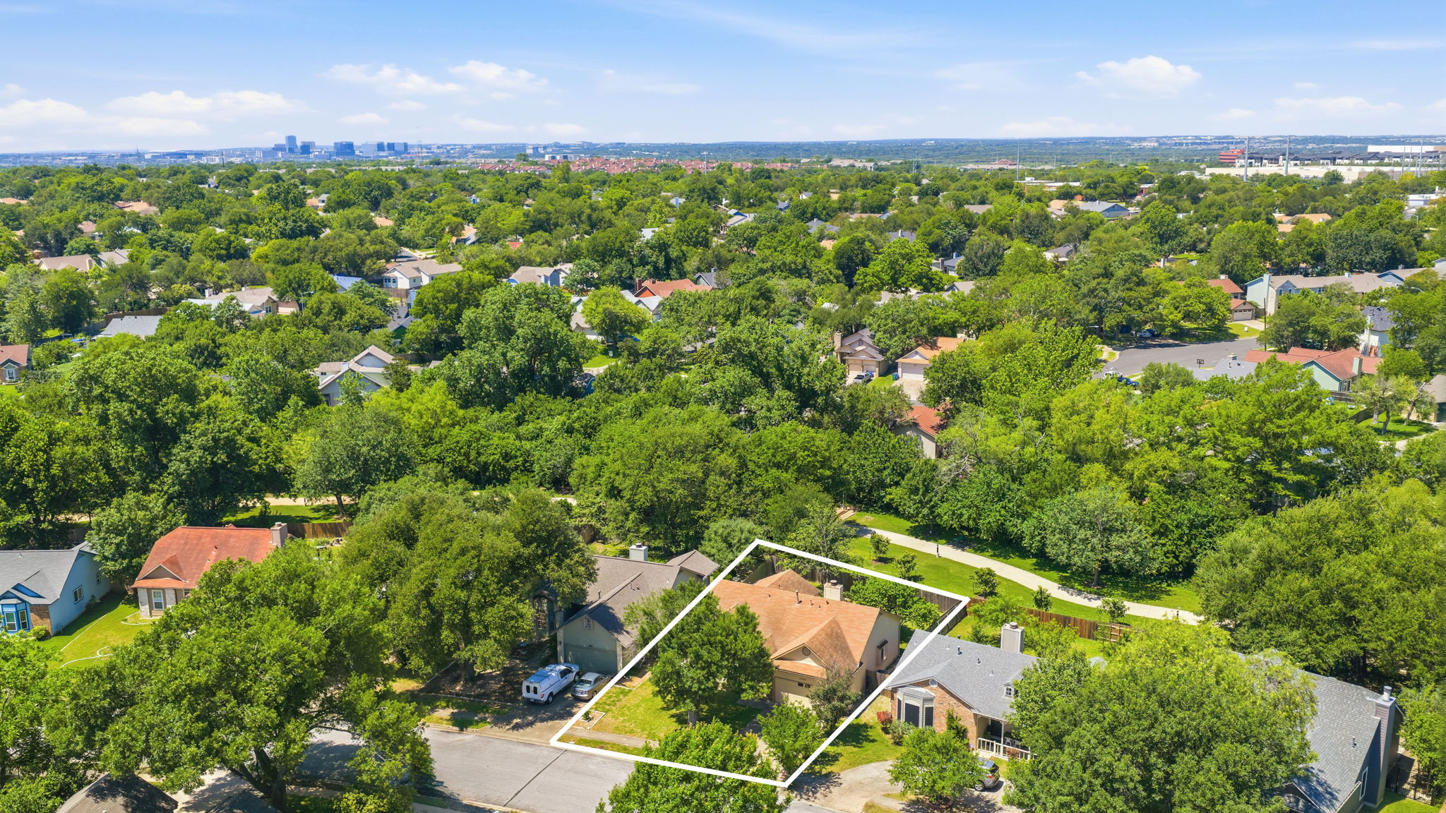 14818 Yellowleaf Trail Austin, TX 78728 - Photo 2 of 26 Aerial perspective showcasing a single-story residence with a prominent tile roof and established landscaping
