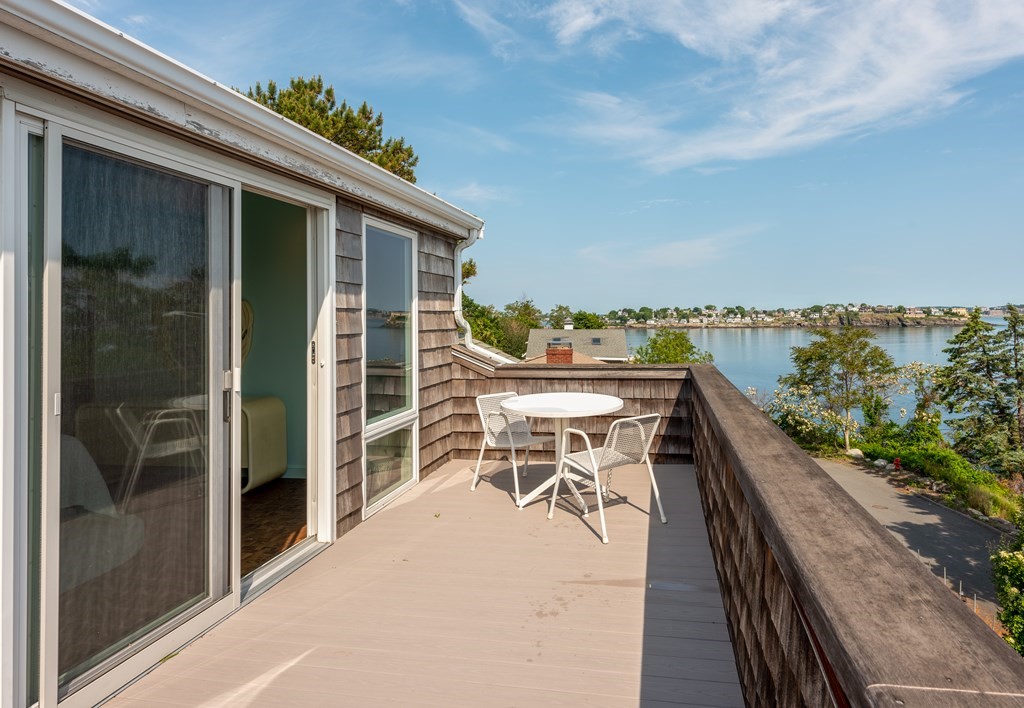 11 Maolis Road Nahant, MA 01908 - Photo 1 of 29 a balcony with table and chairs