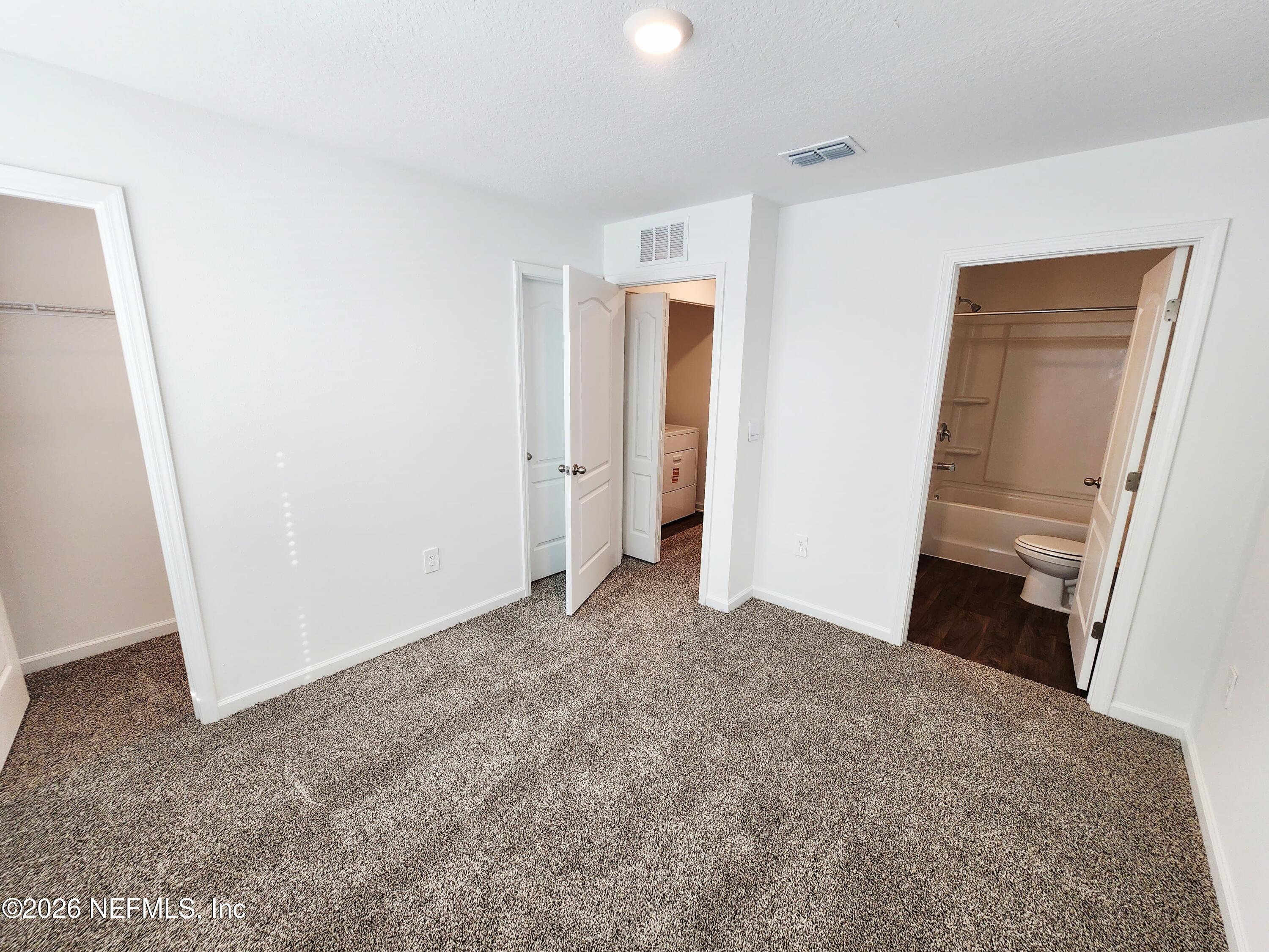 51 Palmetto Rdg Road St. Augustine, FL 32095 - Photo 10 of 16 a view of empty room with front door