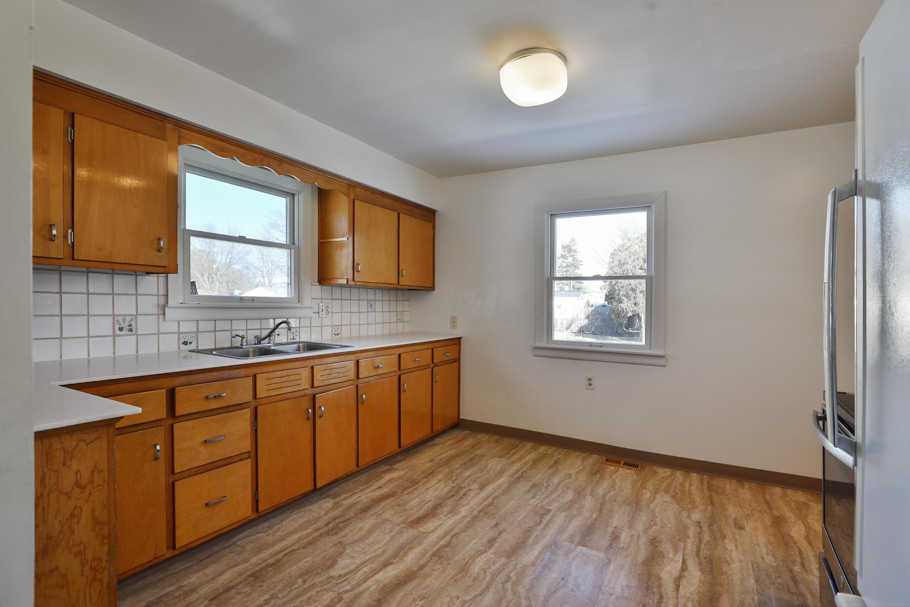 3231 Somerford Road Columbus, OH 43221 - Photo 8 of 35 Vinyl Flooring and Corian Counter Tops.