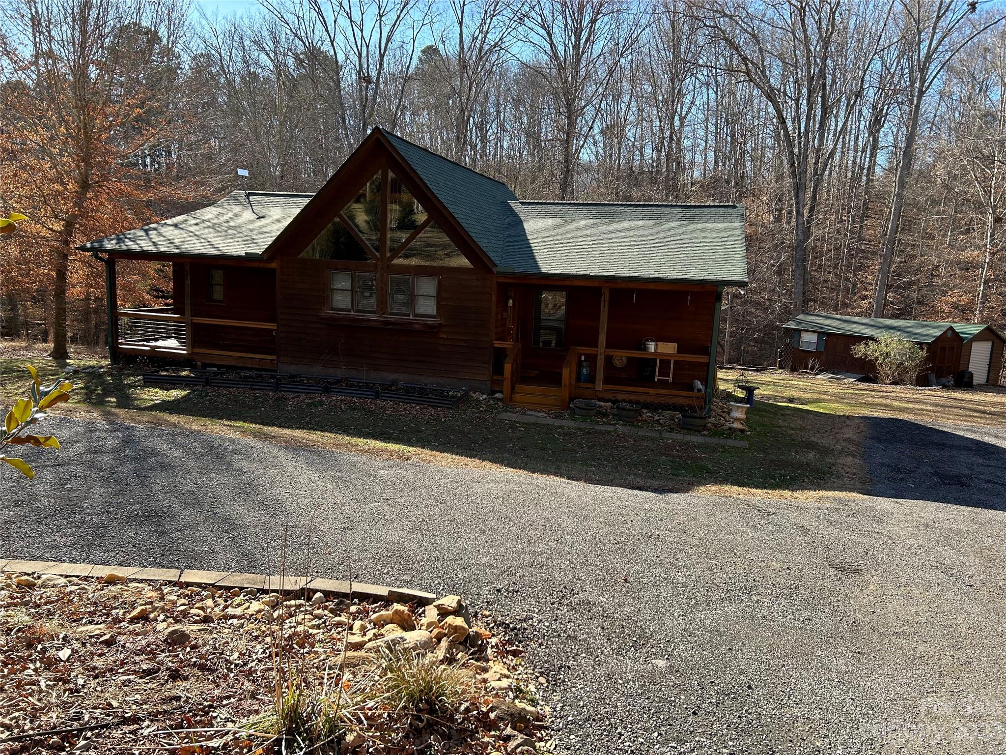 336 Cinnamon Ridge Rutherfordton, NC 28139 - Photo 3 of 22 a front view of a house with a yard