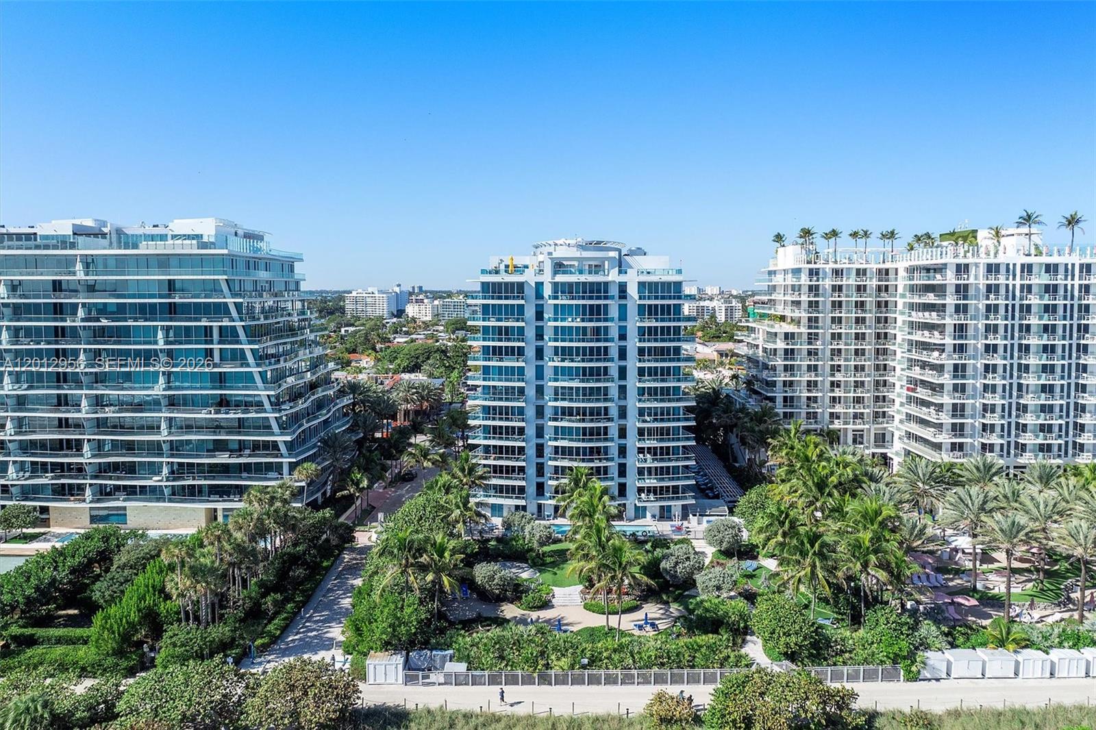 9401 Collins Avenue, Unit 505 Surfside, FL 33154 - Photo 1 of 39 a view of a building with a garden