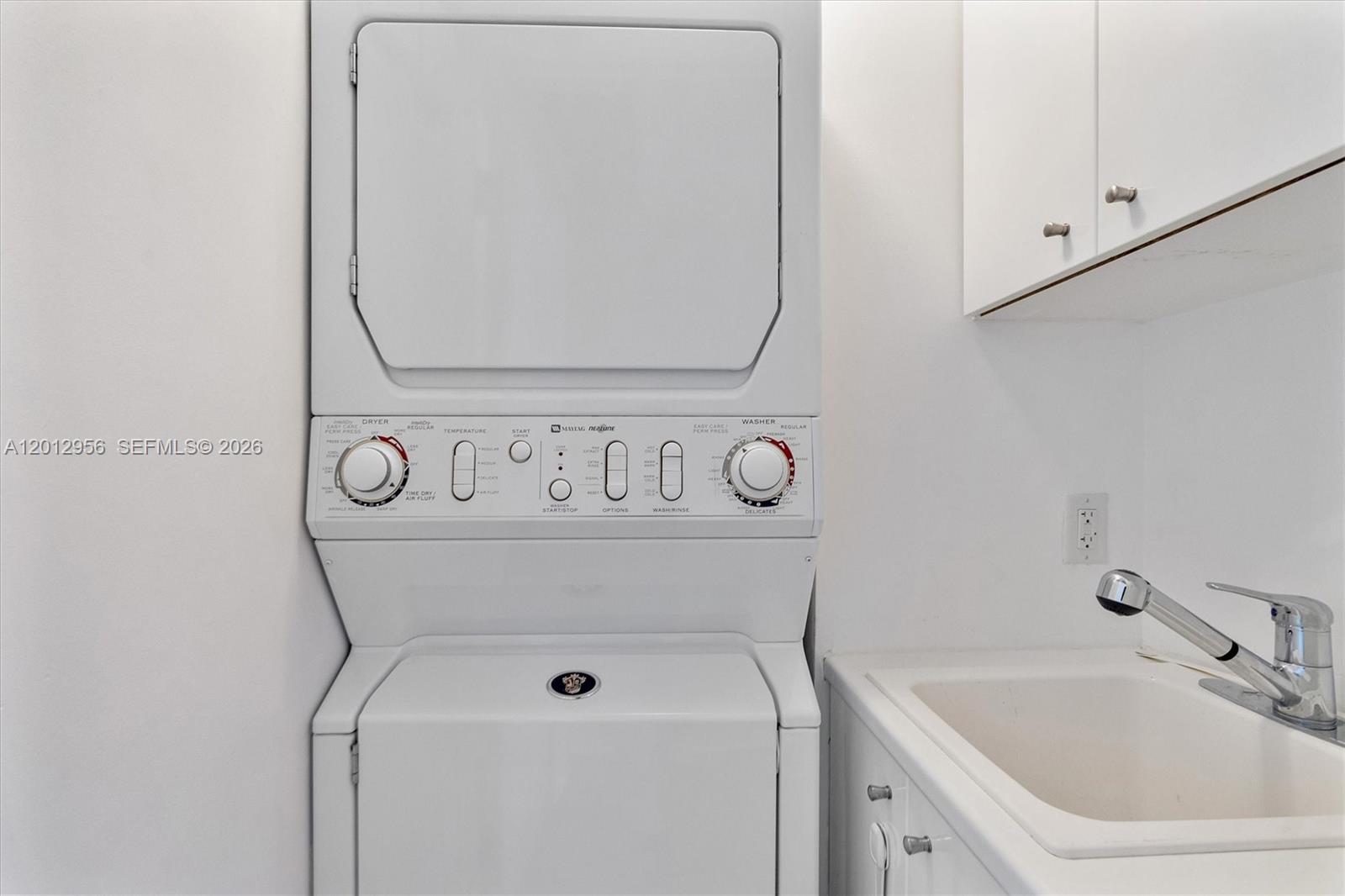 9401 Collins Avenue, Unit 505 Surfside, FL 33154 - Photo 12 of 39 a bathroom with a sink and a mirror