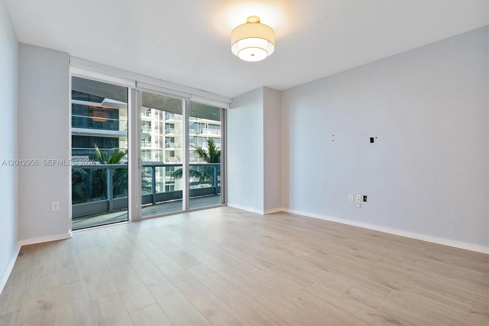 9401 Collins Avenue, Unit 505 Surfside, FL 33154 - Photo 16 of 39 a view of an empty room with a window