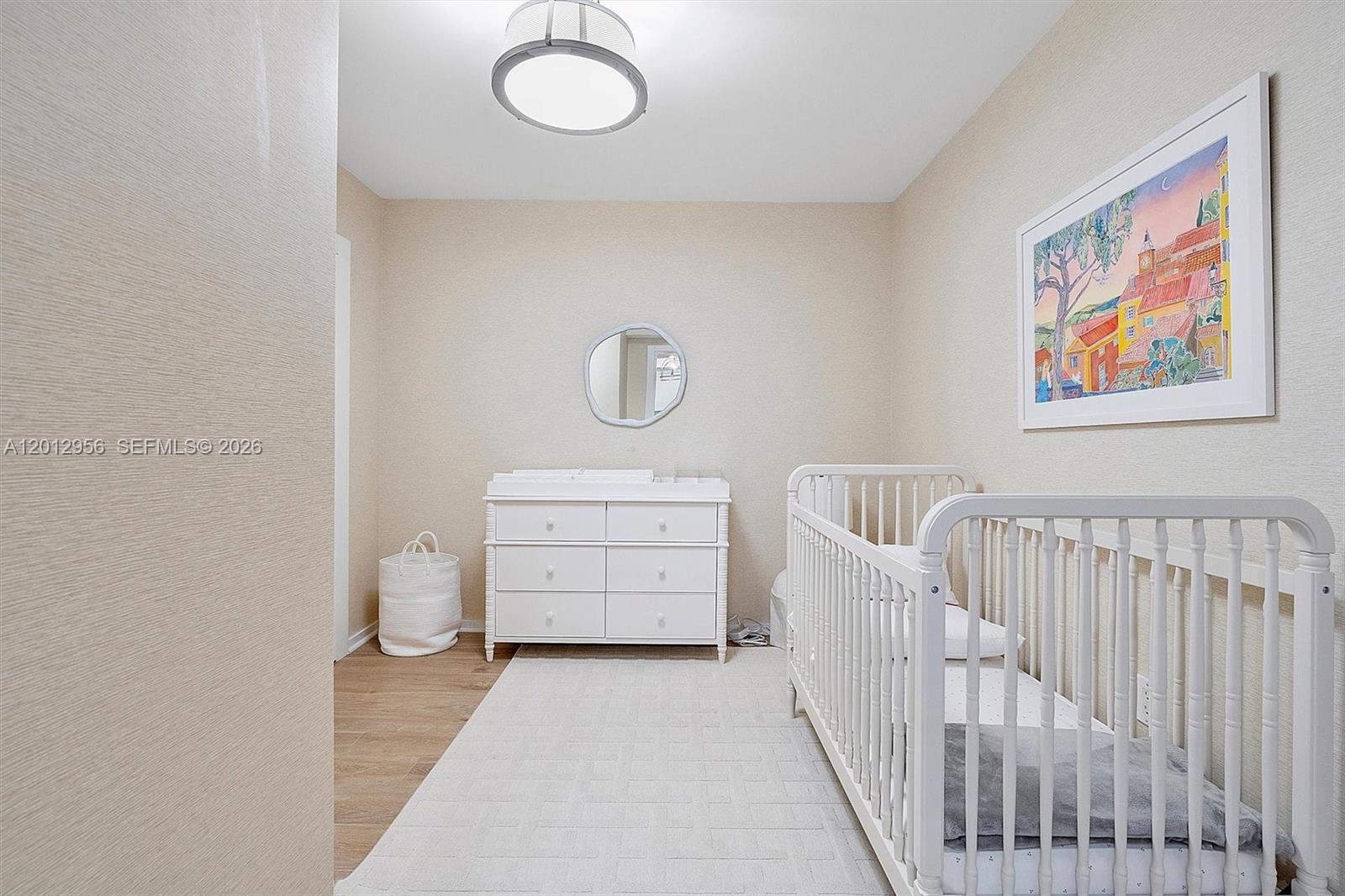 9401 Collins Avenue, Unit 505 Surfside, FL 33154 - Photo 26 of 39 a view of a bedroom with baby bed