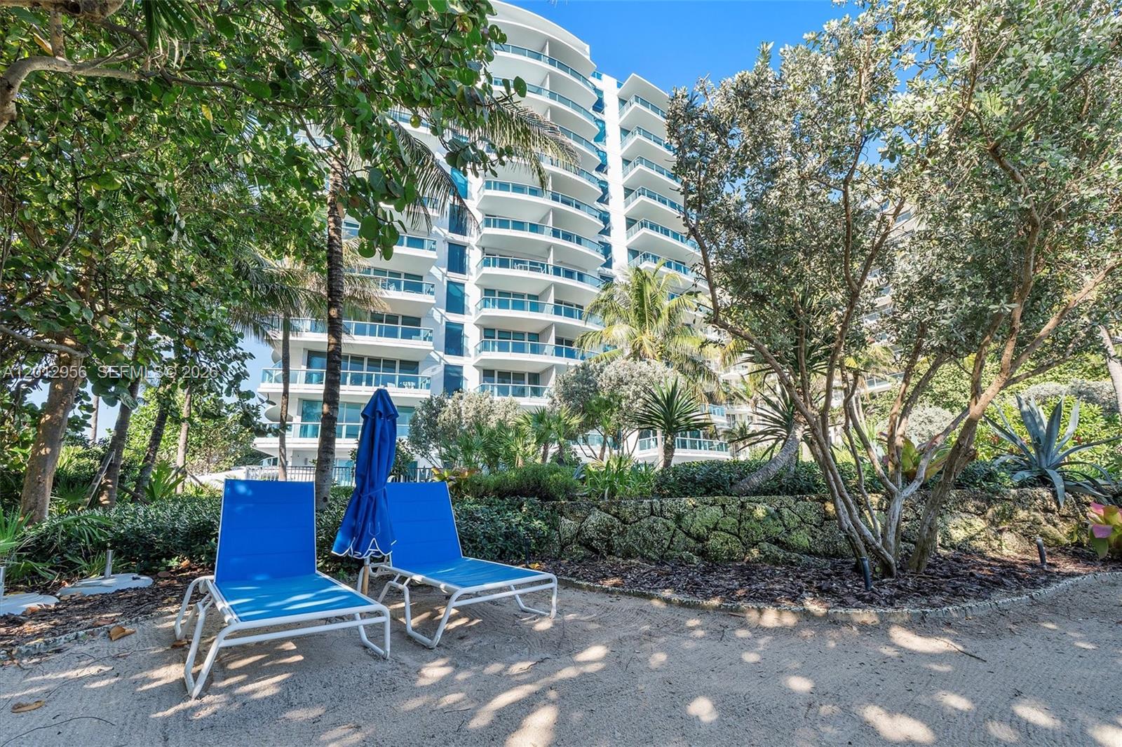 9401 Collins Avenue, Unit 505 Surfside, FL 33154 - Photo 38 of 39 a view of backyard with outdoor seating and trees