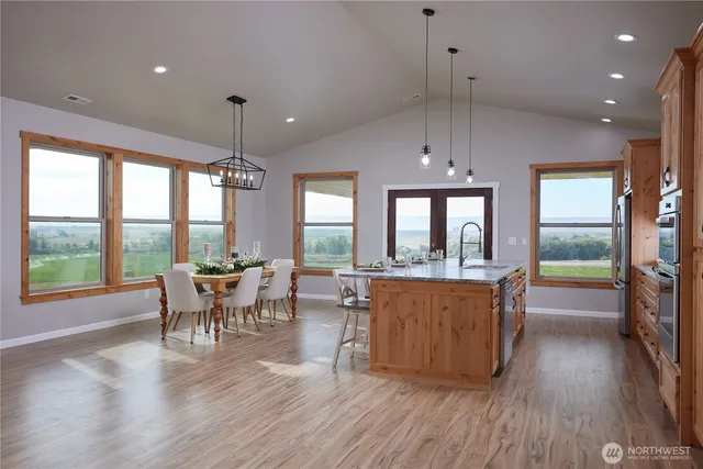 a view of a dining room with furniture window and wooden floor