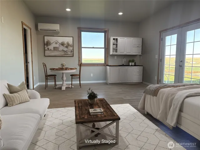 a living room with furniture and a window