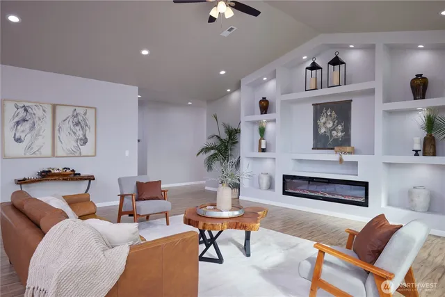 a living room with furniture and a fireplace