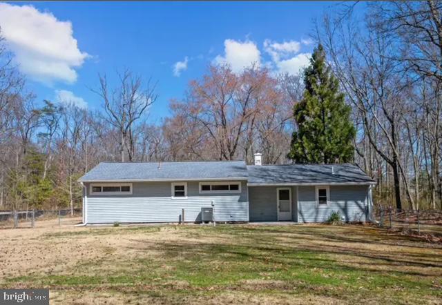 6432 West Shady Side Road Shady Side, MD 20764 - Photo 13 of 13 a front view of a house with a yard