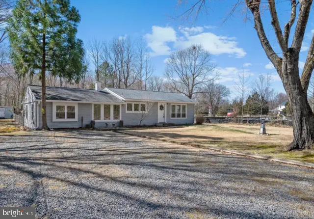 6432 West Shady Side Road Shady Side, MD 20764 - Photo 2 of 13 a view of a house with a yard