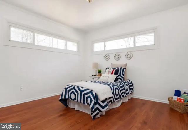 6432 West Shady Side Road Shady Side, MD 20764 - Photo 7 of 13 a bedroom with a bed and a window